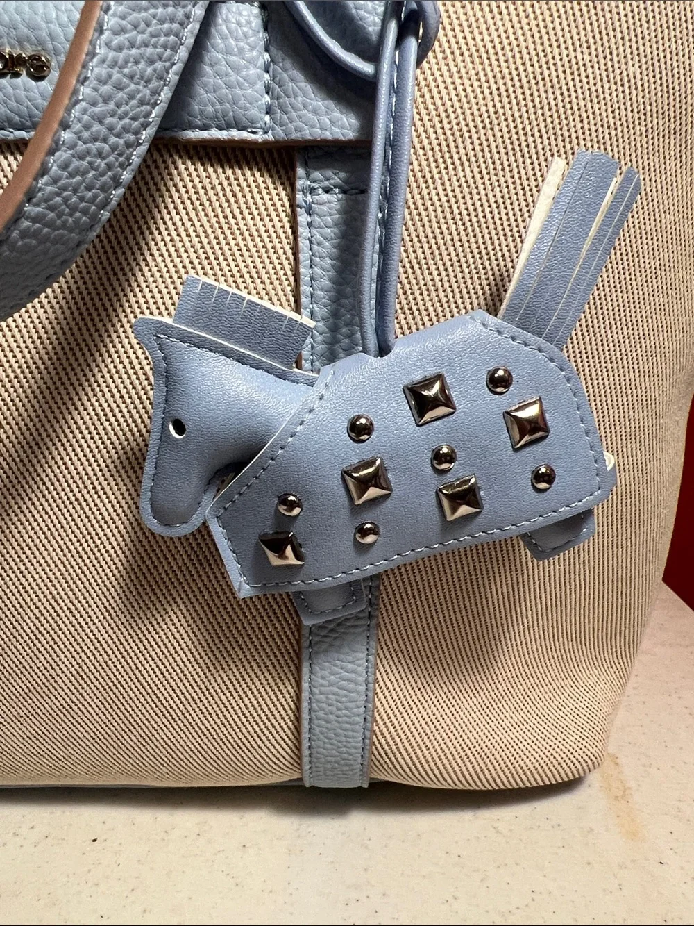 Nanette Lepore Beige Canvas Tote with Light Blue Leather Trim and Charm  RT,148